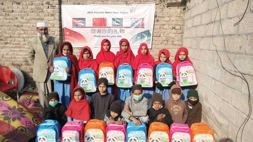 Chinese envoy distributes school bags among school-going children